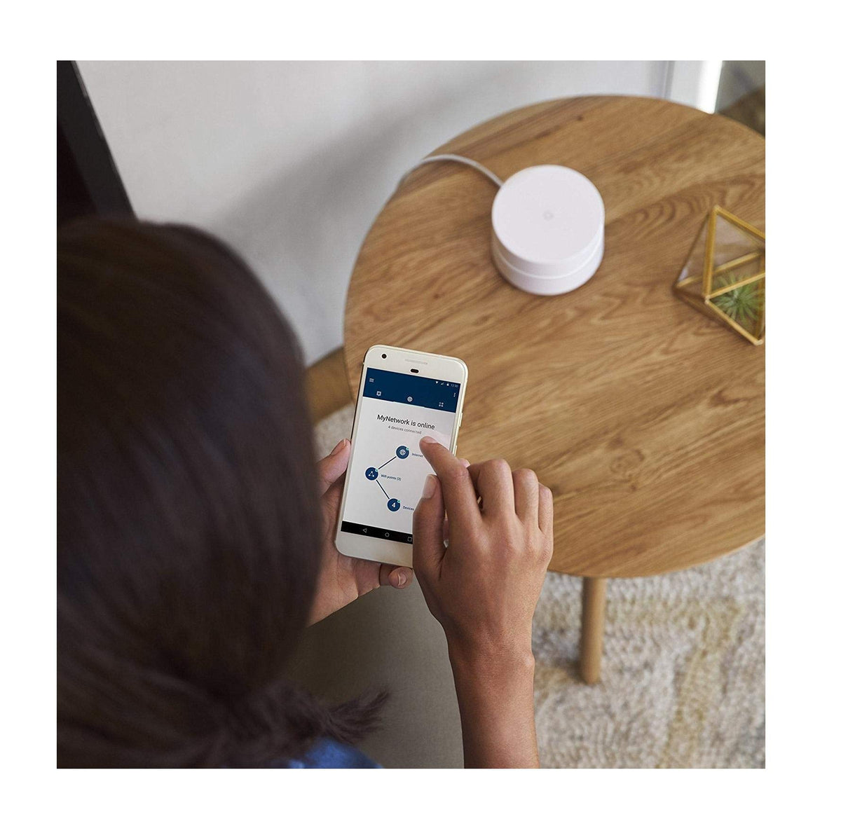 Google WiFi placed in living room demonstrating expanded coverage benefit