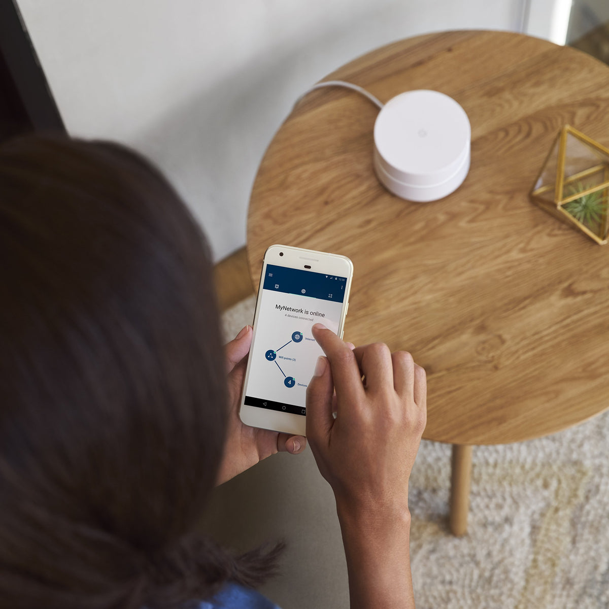 Google WiFi scale with phone showing compact size and simple space-saving benefit