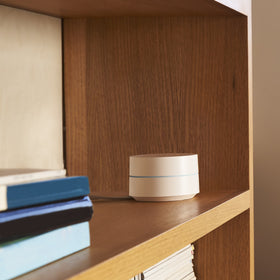 Google WiFi setup in hand showing easy app-guided install and quick connectivity