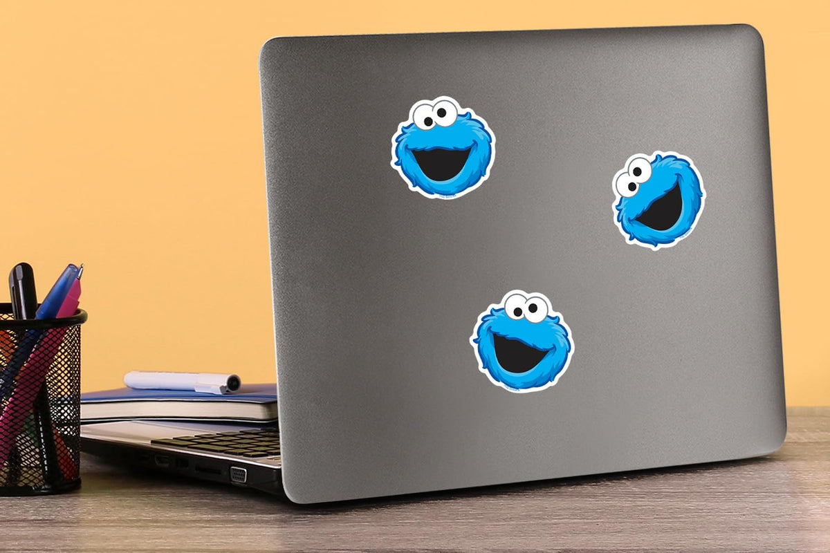 Graphics & More Cookie Monster face sticker on notebook for playful, quick customization.