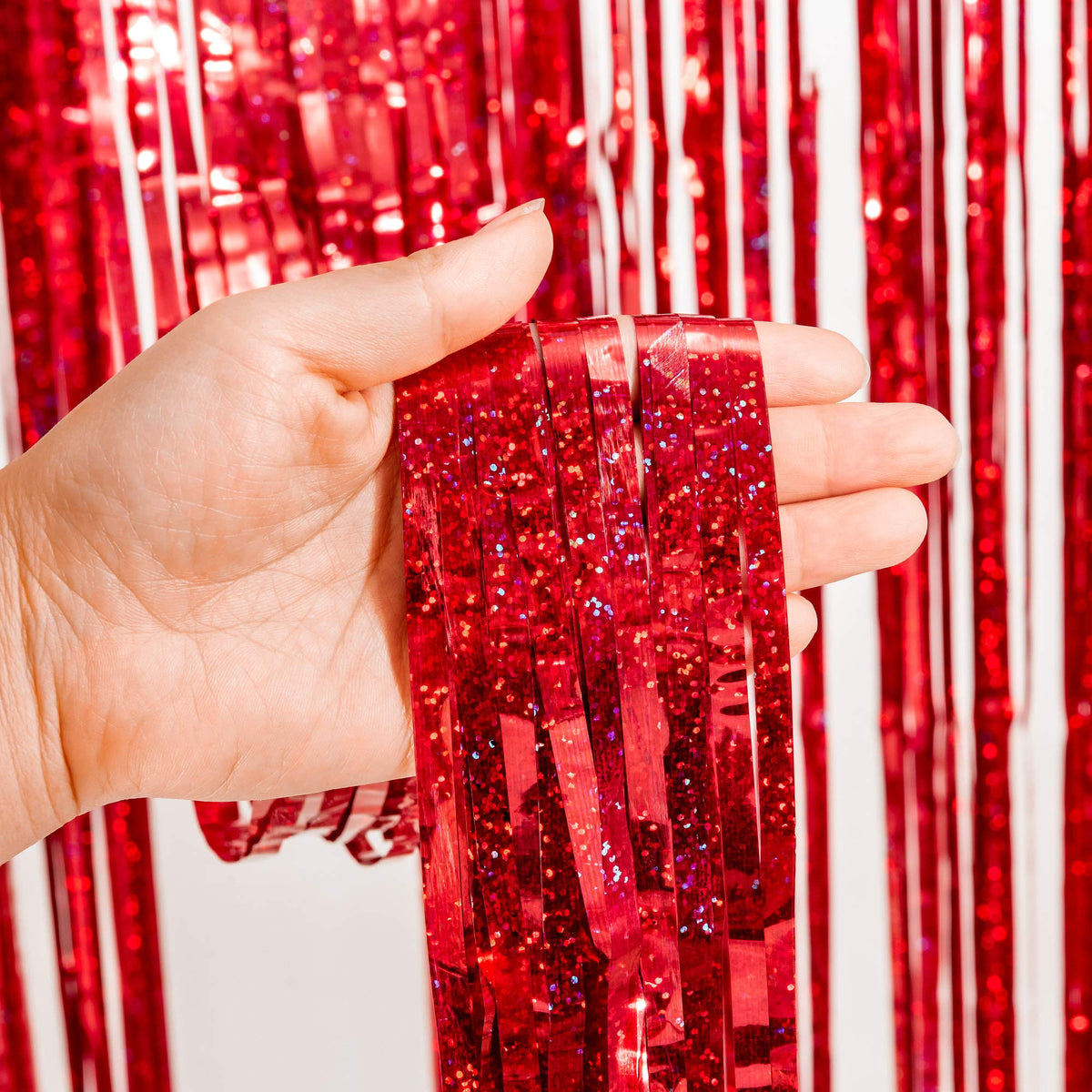 GREATRIL red Christmas decor foil curtain adds festive sparkle to celebrations.