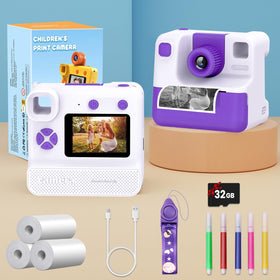 GREENKINDER camera on a bedroom table with prints and colored pencils showing playful use