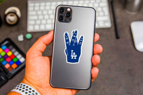 GROWING baseball stickers decorate a laptop with crisp, waterproof graphics.