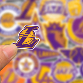 GROWING Lakers stickers on a skateboard display bold court vibes anywhere.