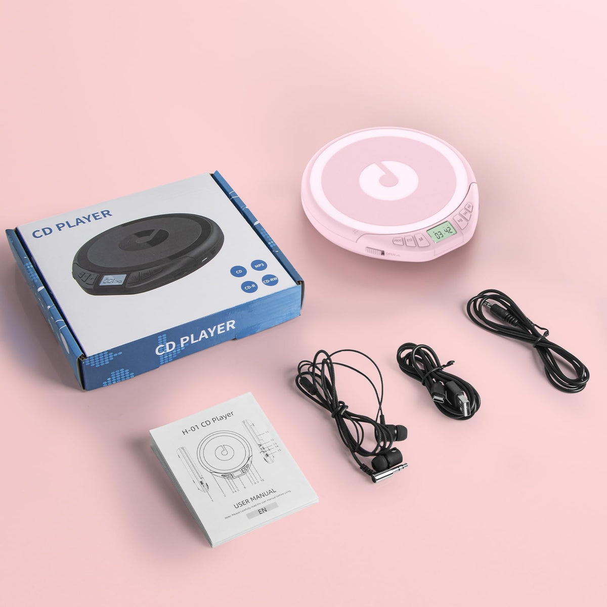 Gueray playing CD in a casual setting highlighting on-the-go listening