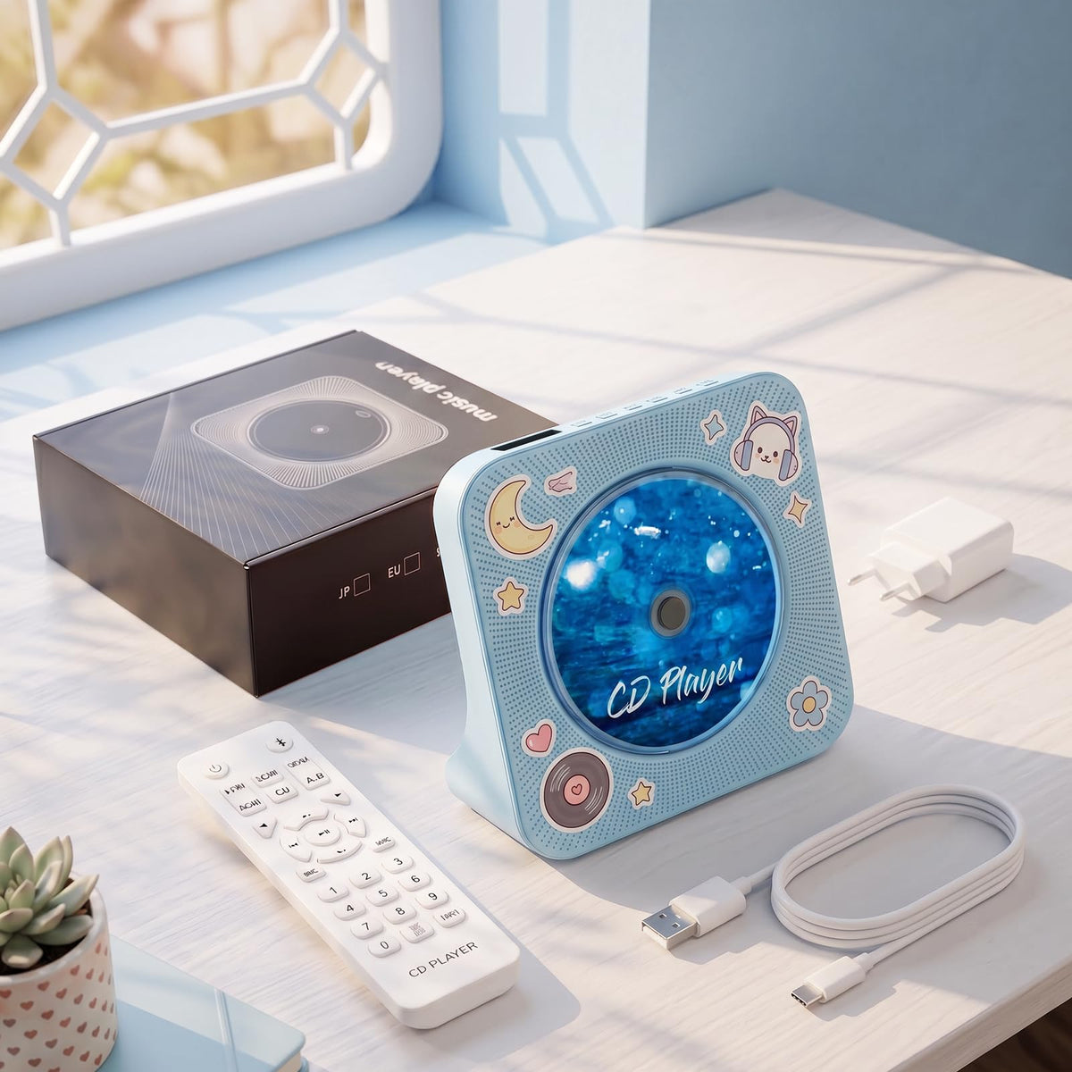 gueray next to a book for scale, compact desktop footprint demonstration