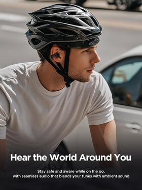 HAKII earbuds worn by runner showing secure fit and safety benefit
