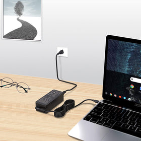 HBONY charger in use powering a laptop at a cafe.