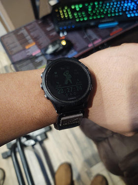 hemsut h strap attached to Garmin watch during activity showing durability