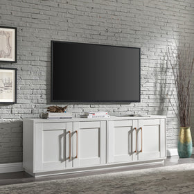 Two concealed cabinets behind brass hardware for hidden media clutter