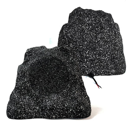 Herdio outdoor rock speakers front view blending with yard while delivering clear sound
