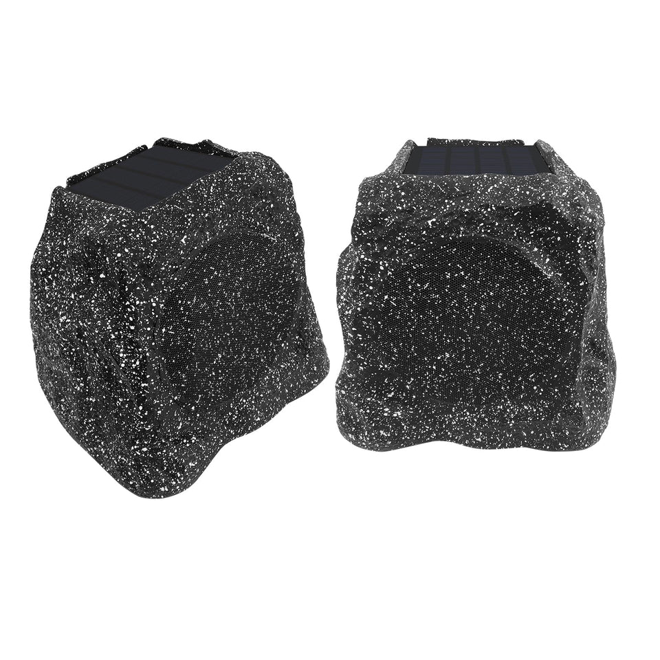 Herdio rock speaker front view with solar panel for outdoor charging and day-long playback.