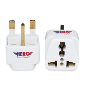 Hero Travel Supply UK adapter plugged into a wall outlet during a trip.