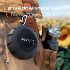 HEYSONG in a hand showing compact size and portable convenience