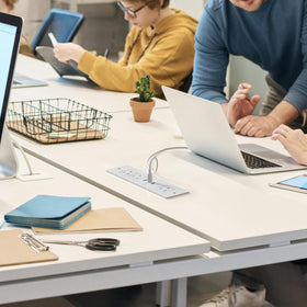 HEZI lifestyle desk setup demonstrating clutter-free workspace and organized charging