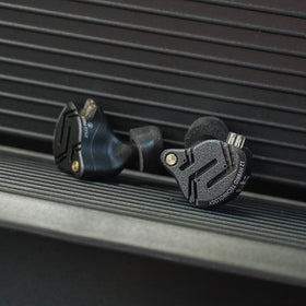 H HIFIHEAR KZ ZS12 PRO X size comparison with a coin showing compact form for portable use