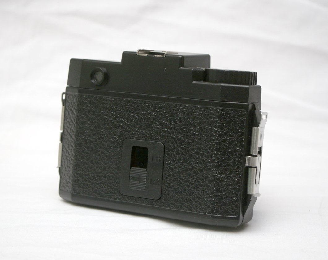 HOLGA 120N lens closeup highlighting plastic lens that creates soft, dreamy images