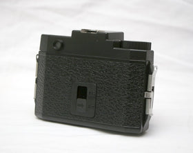 HOLGA 120N lens closeup highlighting plastic lens that creates soft, dreamy images