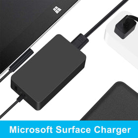 HOME PUFF charger with USB 2.0 port charges a phone alongside Surface.