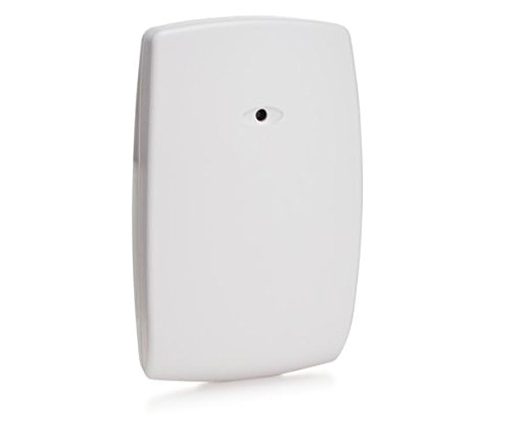 Honeywell 5853 near window in living room illustrating discreet protection