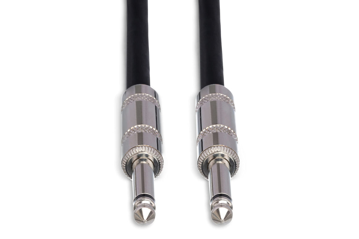 Hosa SKJ-620 in a stage setup between amp and speaker showing flexible reach benefit