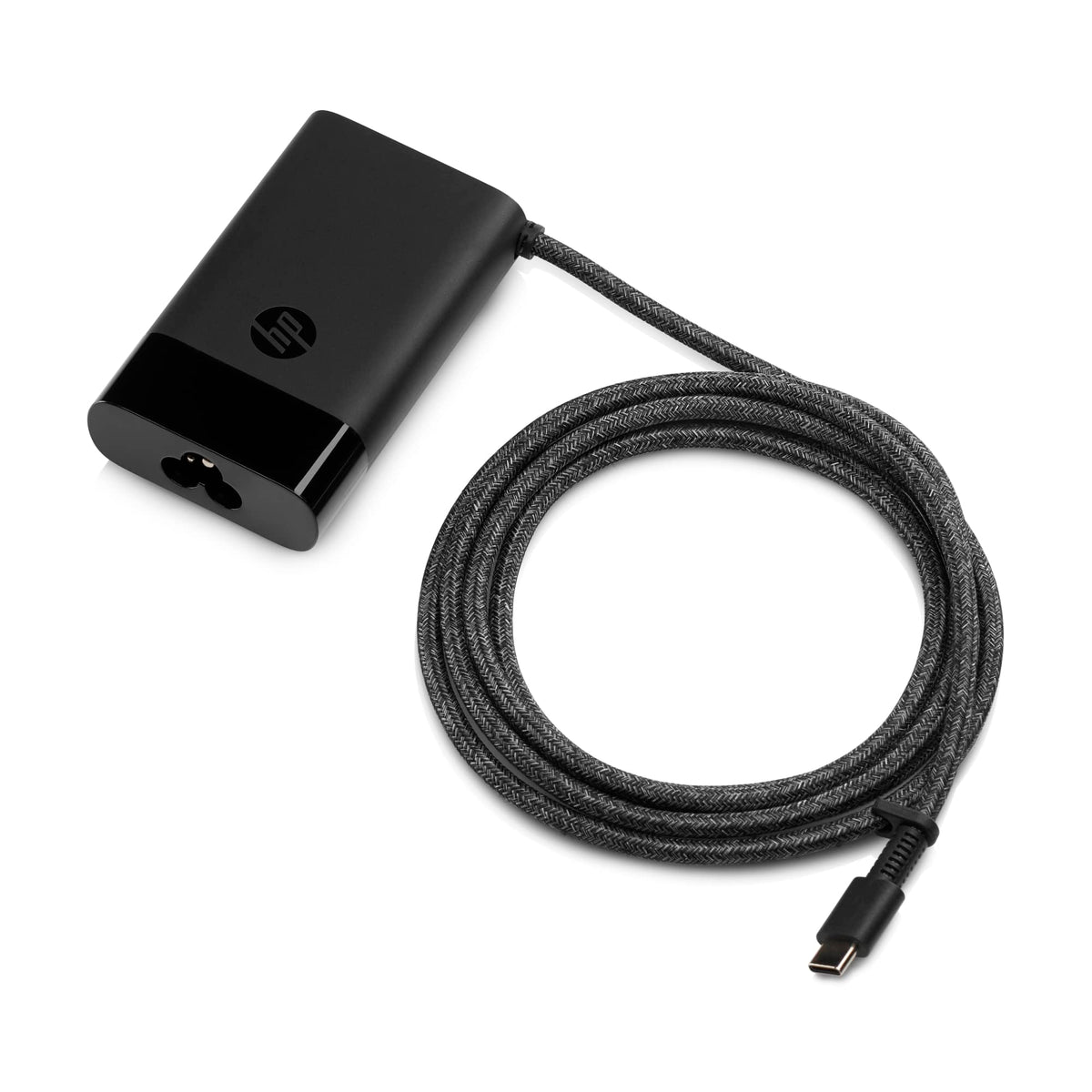 HP 65W charger inside backpack demonstrating convenient travel carry