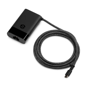 HP 65W charger inside backpack demonstrating convenient travel carry