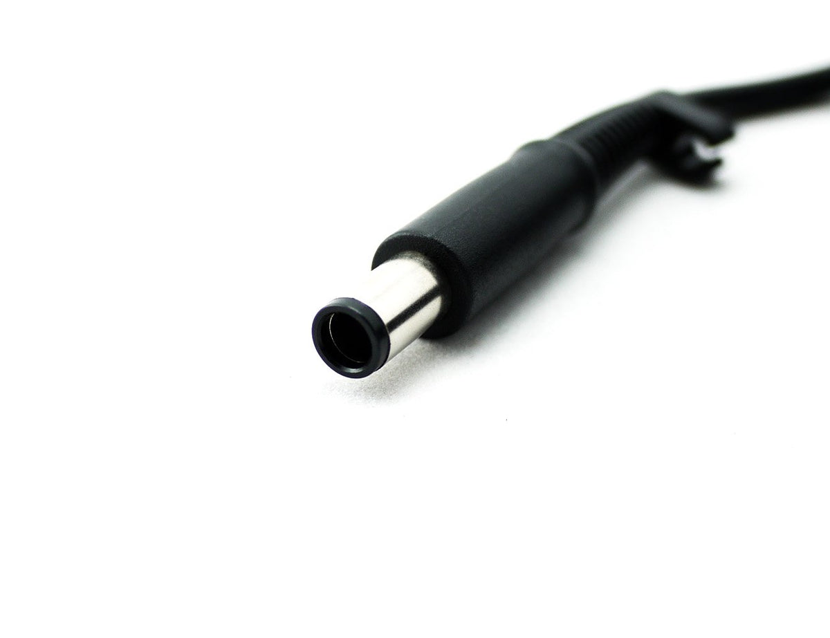 HP adapter plugged into laptop on desk illustrating convenient charging setup