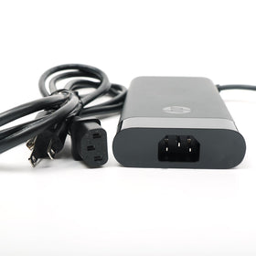 HP adapter on desk with laptop for a tidy, dependable workstation