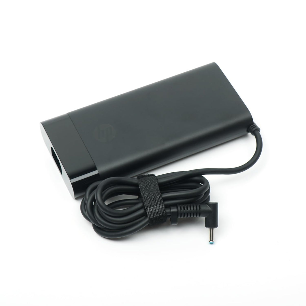 HP adapter next to ruler for size comparison and portability benefit