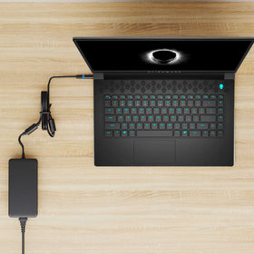 HXHTEC adapter powering an Alienware laptop demonstrating reliable full-power charging benefit