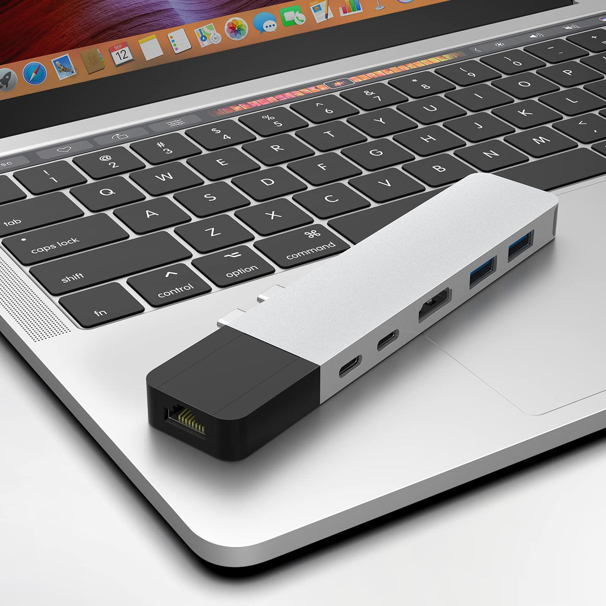 HyperDrive USB-C hub connected to a MacBook for charging and data