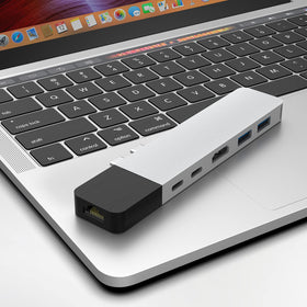 HyperDrive USB-C hub connected to a MacBook for charging and data