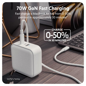 Hyper charger next to passport and phone for scale, emphasizing lightweight portability