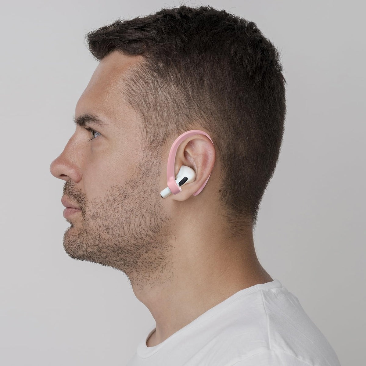 ICARERSPACE pink earhook demonstrating secure fit for running and cycling.