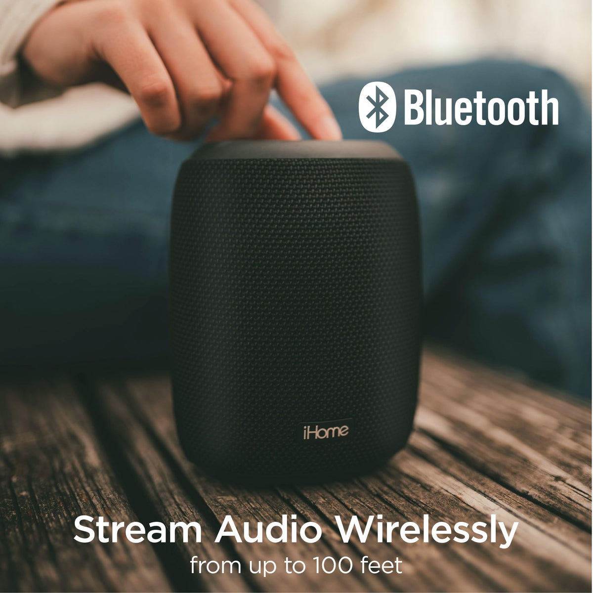iHome iBT700 held in a hand to show compact size and easy take-anywhere advantage