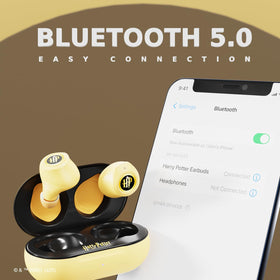 iJoy Hufflepuff earbuds in hand for scale showing compact pocketable design