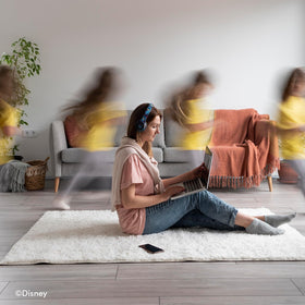 iJoy lifestyle shot of person wearing headphones for everyday use
