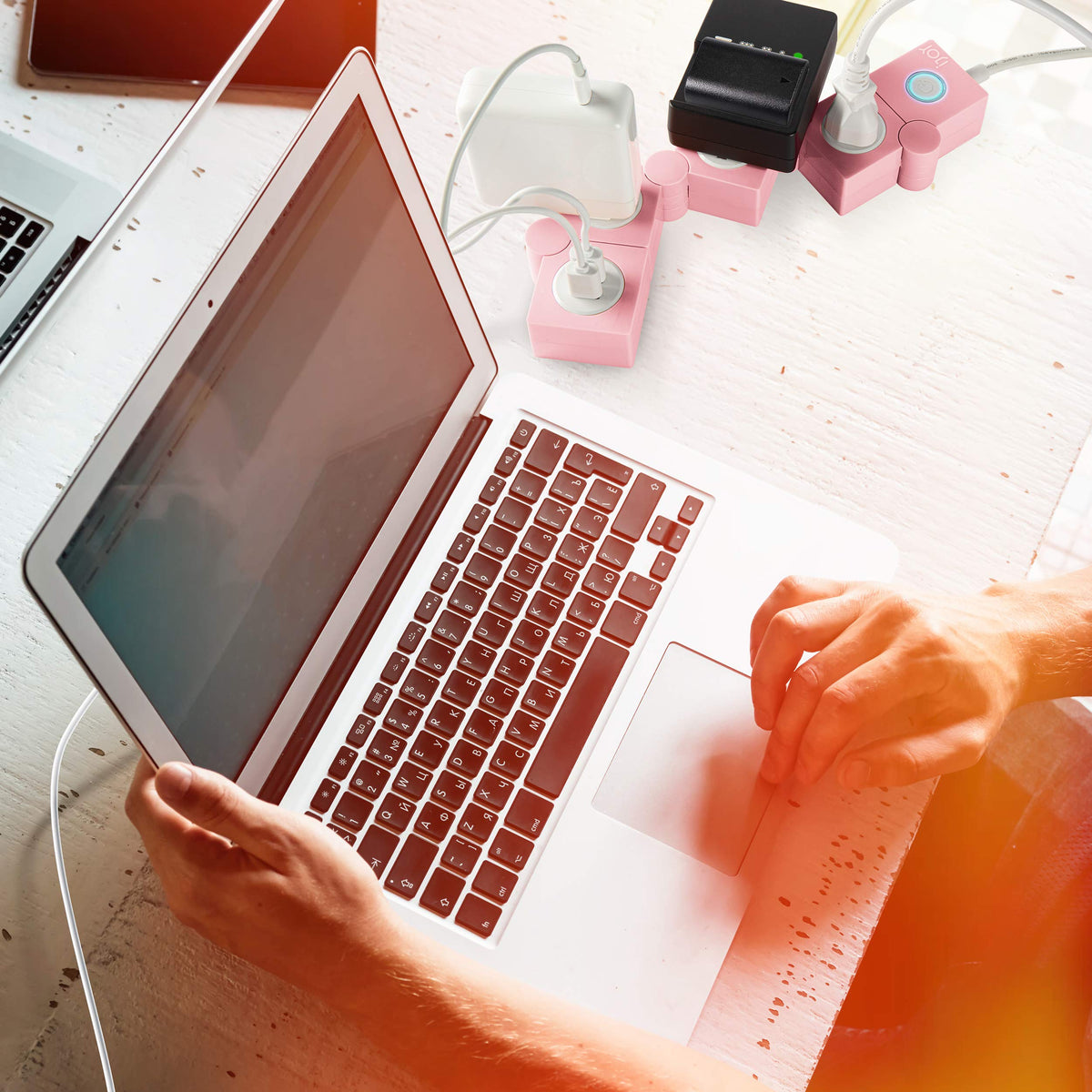iJoy pink power strip blends with decor while keeping electronics organized.