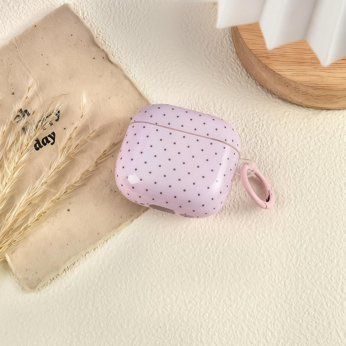 inewateri AirPods 4 case pink polka dot, side view, durable grip.