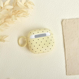 inewateri AirPods 4 yellow polka-dot case provides dust protection when not charging.