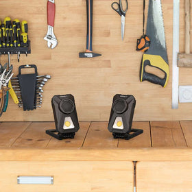 Infinity X1 hanging by carabiner from a beam for overhead illumination on jobsites