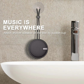 INSMY C12 on a beach towel showing rugged outdoor use and clear sound