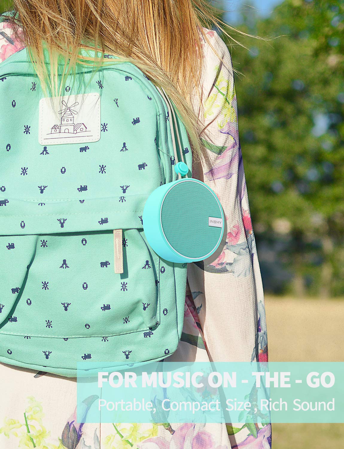 INSMY C12 hanging from lanyard outdoors for hands-free use and transport