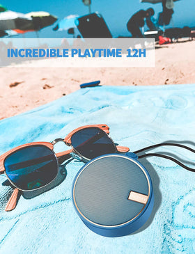 INSMY C12 lifestyle shot at beach highlighting durable audio for outdoor enjoyment