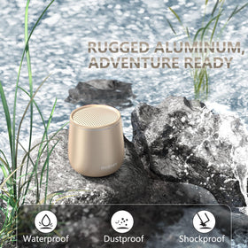 INSMY waterproof mini speaker in gold, top view ready for poolside use