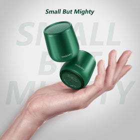 INSMY waterproof mini speaker outdoors by poolside for weatherproof listening.