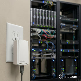 Insteon PowerLinc beside ruler for scale showing compact size and portability