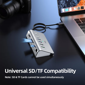 intpw P9R next to laptop illustrating compact size and real-world scale