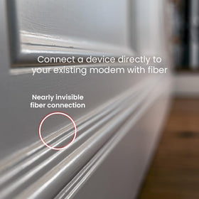 InvisiLight media converters at each end enabling Ethernet devices to connect via fiber.